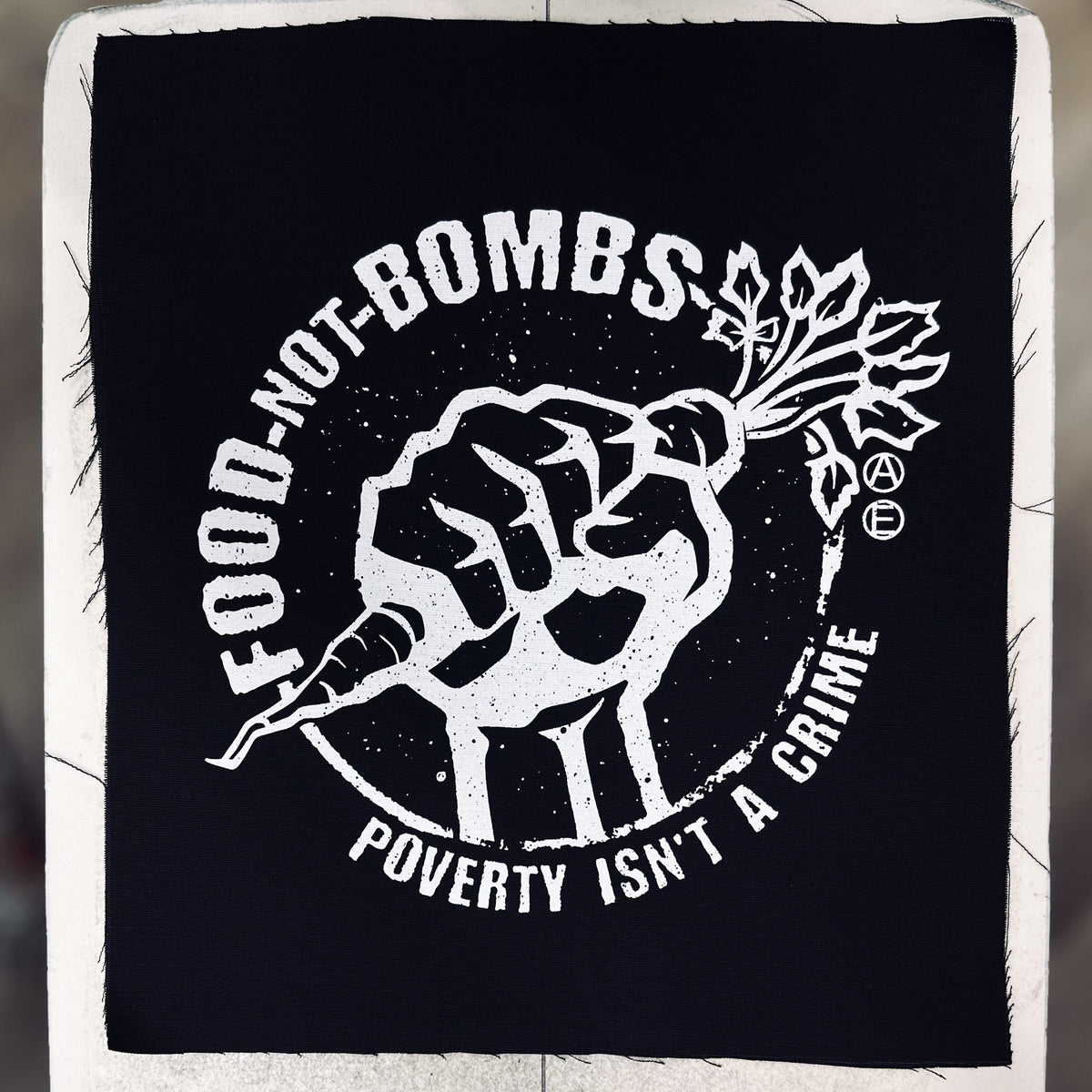 Food Not Bombs Carrot - Poverty Isn't A Crime - Backpatch - Mutual Aid Design