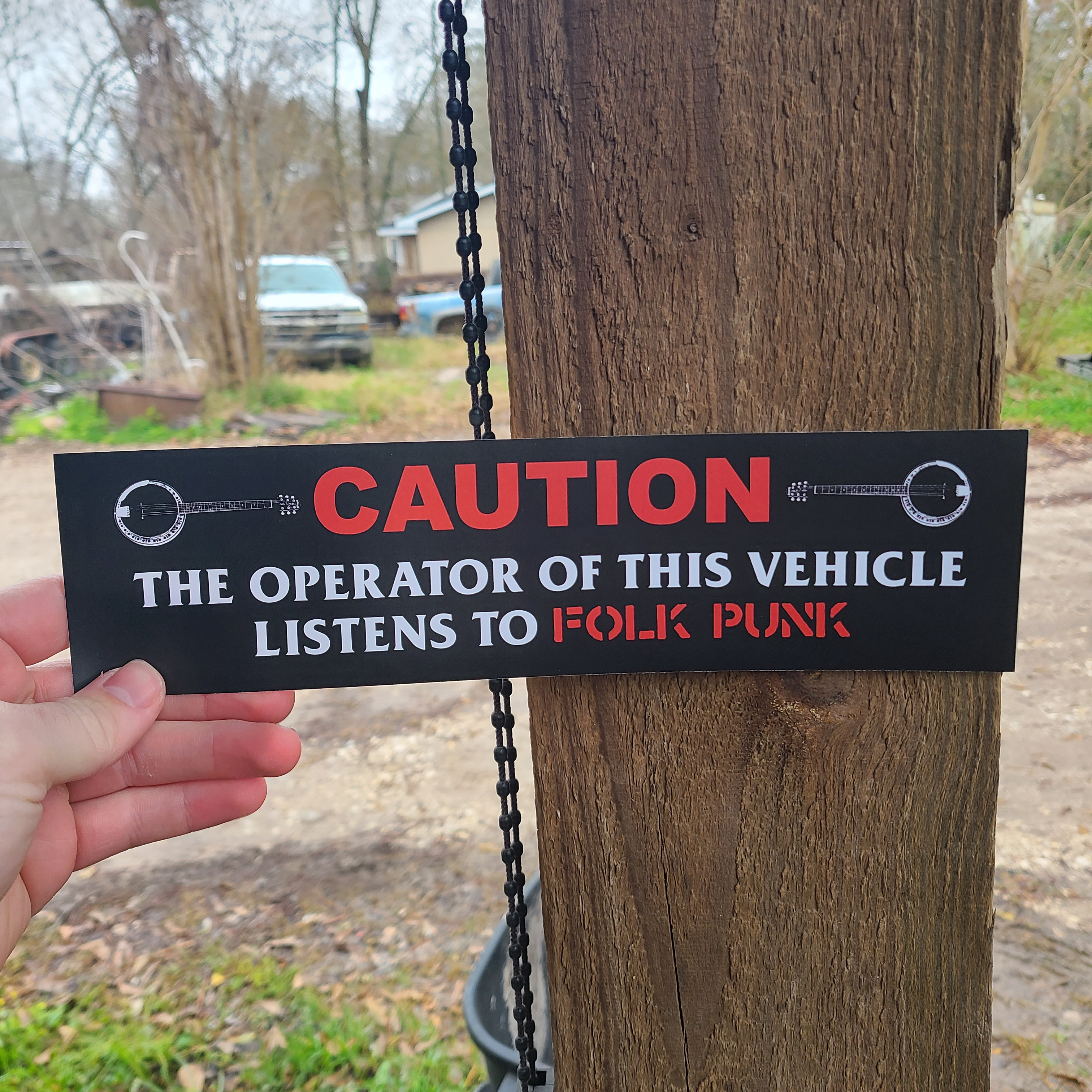 Caution The Operator Of This Vehicle Listens To Folk Punk - Bumper Sticker (11.5X3)