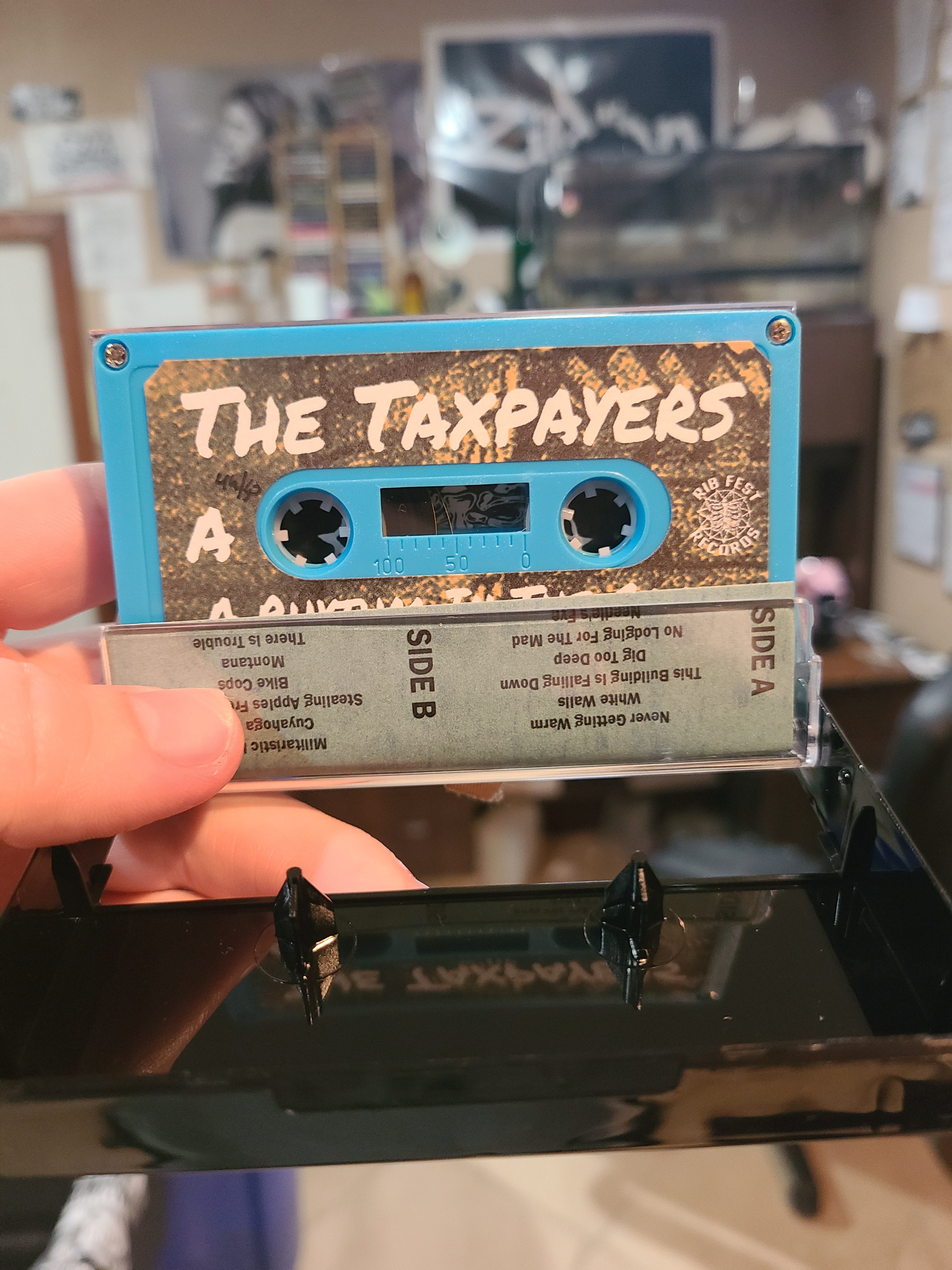 The Taxpayers - A Rhythm In The Cages - Cassette Tape Physical Media