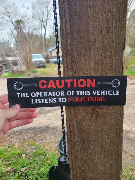Caution the operator of this vehicle listens to folk punk - Bumper Sticker (11.5X3)